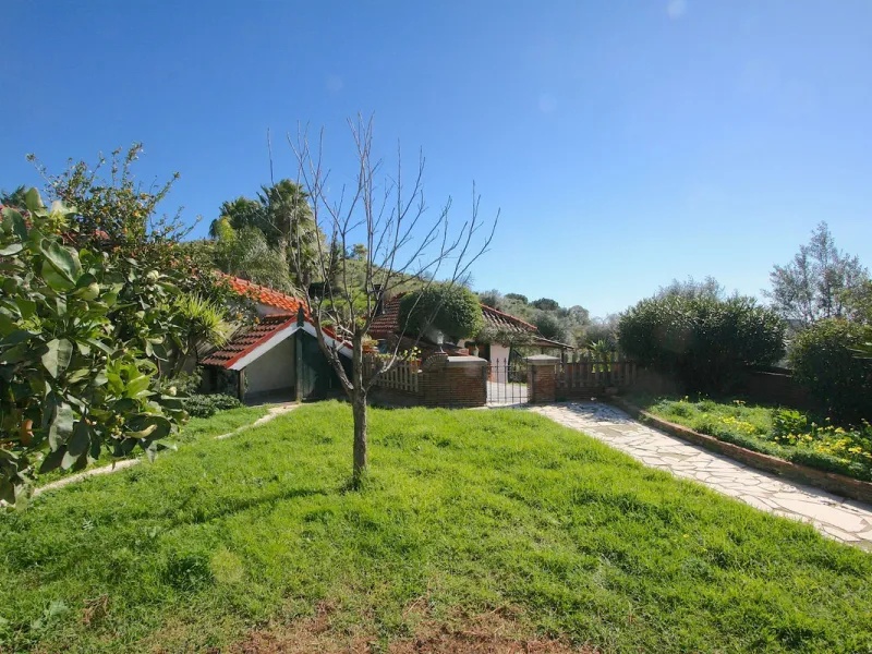 A rare opportunity to own a truly enchanting estate near the picturesque Mijas Pueblo. Set on an expansive 16,000 m² plot, this gated property offers breathtaking panoramic views surrounded by fruit trees, almond trees, and olive groves, creating a peacef