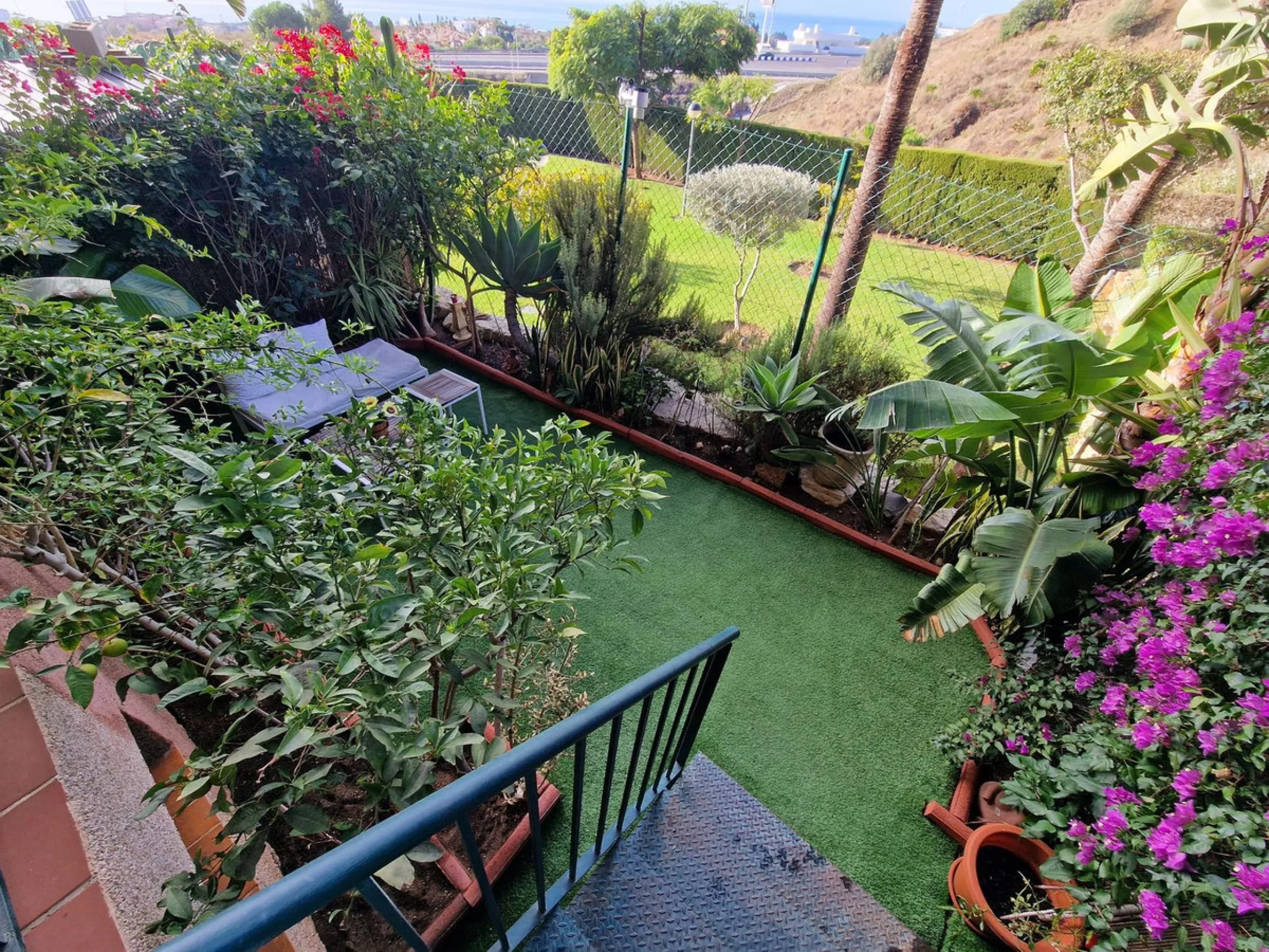 Price reduction !! Immaculate, beautifully reformed, spacious ground floor duplex apartment with 2 terraces, private garden AND sea and pool views!!  Located in a quiet corner of this fabulous community, the apartment, at entry level, consists of hallway,