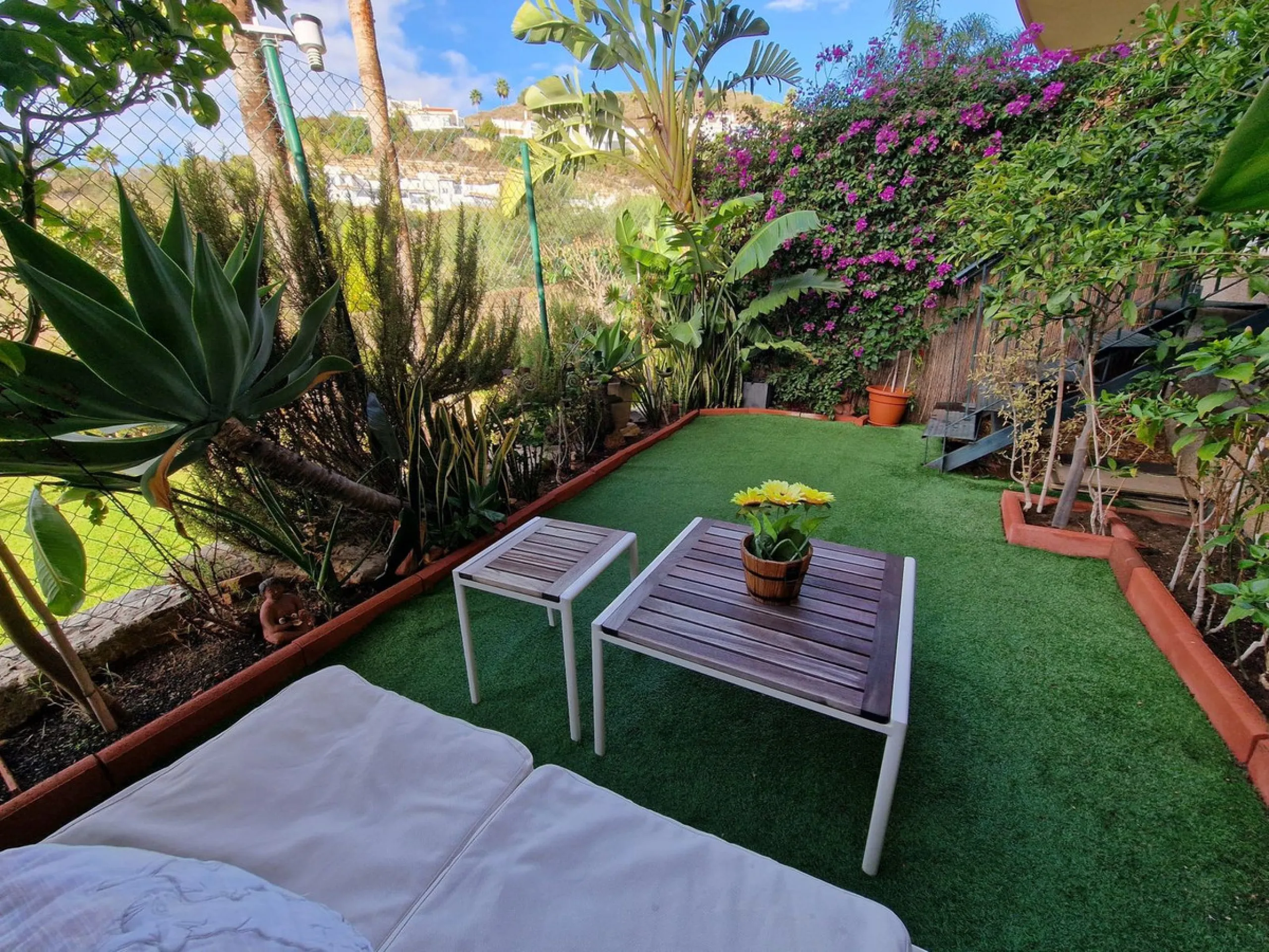 Price reduction !! Immaculate, beautifully reformed, spacious ground floor duplex apartment with 2 terraces, private garden AND sea and pool views!!  Located in a quiet corner of this fabulous community, the apartment, at entry level, consists of hallway,