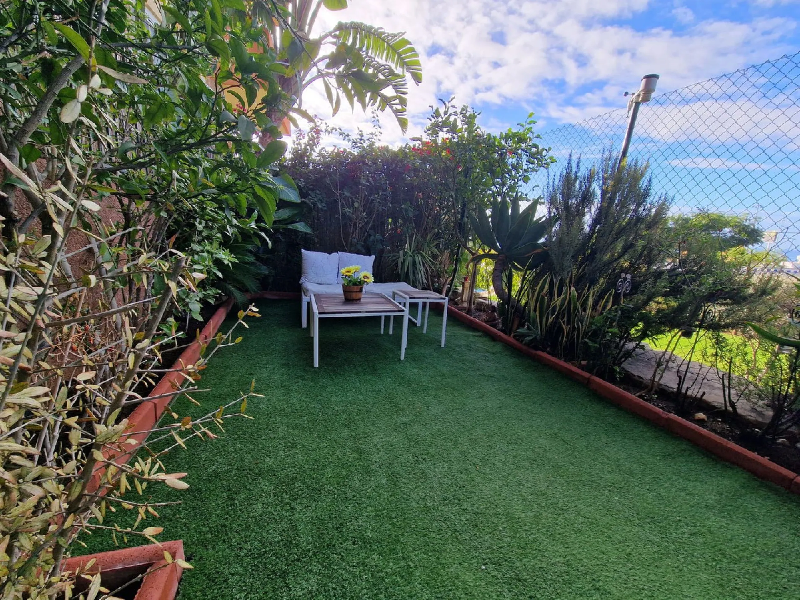 Price reduction !! Immaculate, beautifully reformed, spacious ground floor duplex apartment with 2 terraces, private garden AND sea and pool views!!  Located in a quiet corner of this fabulous community, the apartment, at entry level, consists of hallway,