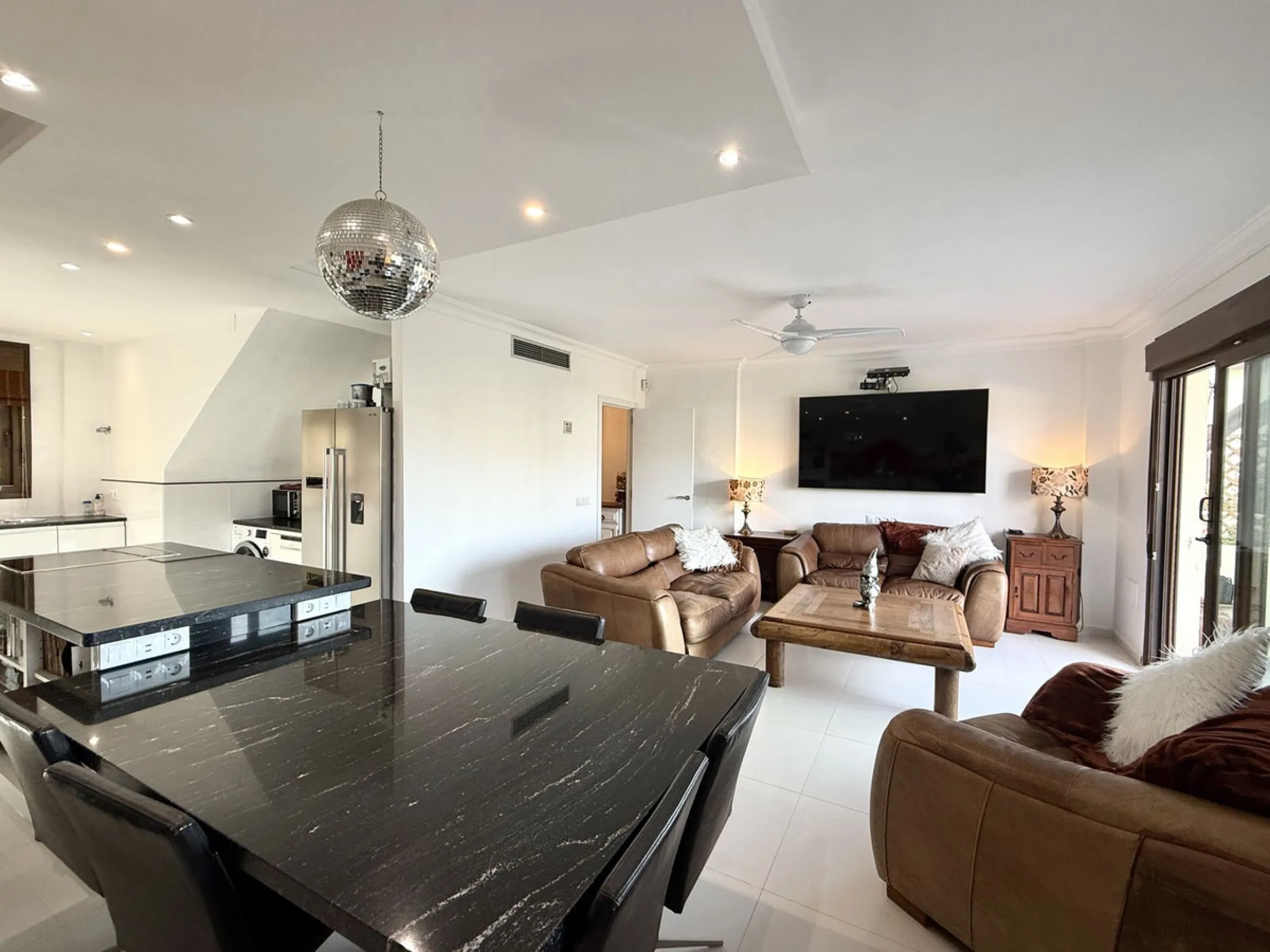 Bright and spacious detached villa with private pool on terrace, yet located in a gated community. This unique property is distributed over two floors, the ground floor comprising a hallway, stunning lounge/dining room with open plan, newly fitted modern 