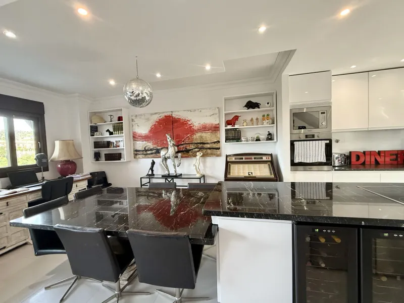 Bright and spacious detached villa with private pool on terrace, yet located in a gated community. This unique property is distributed over two floors, the ground floor comprising a hallway, stunning lounge/dining room with open plan, newly fitted modern 