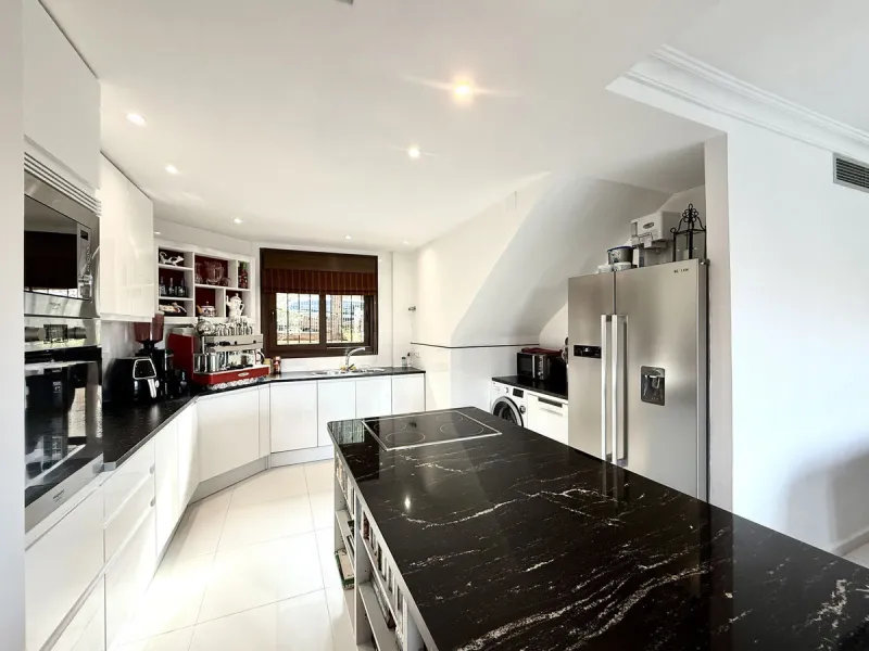 Bright and spacious detached villa with private pool on terrace, yet located in a gated community. This unique property is distributed over two floors, the ground floor comprising a hallway, stunning lounge/dining room with open plan, newly fitted modern 
