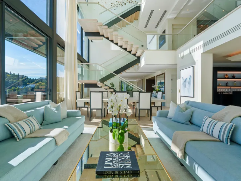 A five-bedroom villa in El Madroñal, Benahavís, offering five bathrooms plus a guest cloakroom, with a first floor dedicated to the master suite with dressing room and library alongside a guest ensuite, a ground floor arranged around formal and informal l