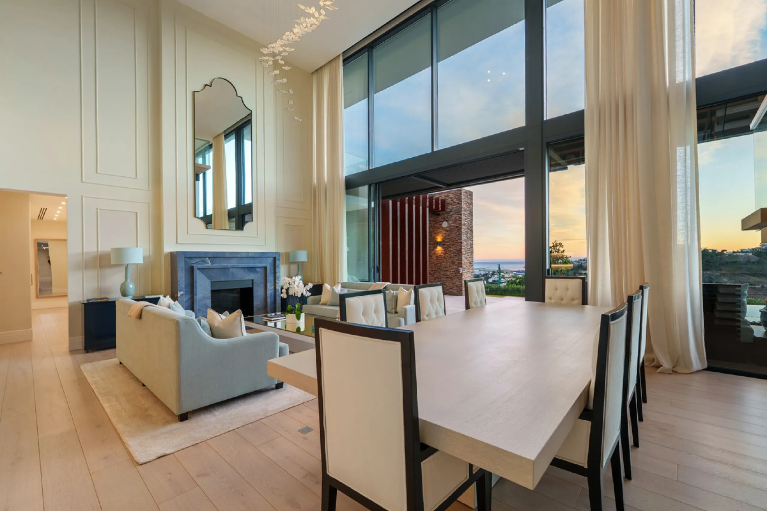A five-bedroom villa in El Madroñal, Benahavís, offering five bathrooms plus a guest cloakroom, with a first floor dedicated to the master suite with dressing room and library alongside a guest ensuite, a ground floor arranged around formal and informal l
