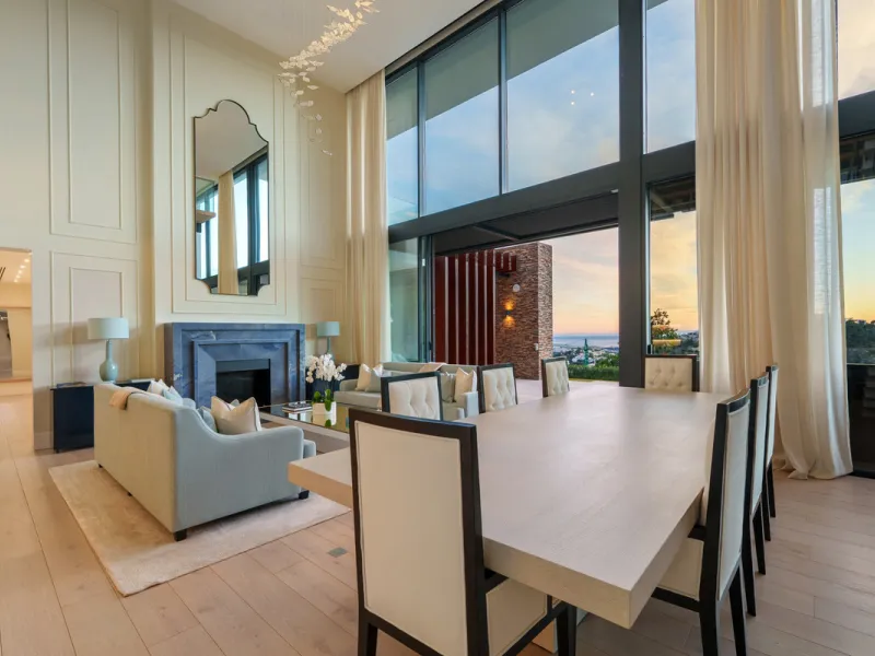 A five-bedroom villa in El Madroñal, Benahavís, offering five bathrooms plus a guest cloakroom, with a first floor dedicated to the master suite with dressing room and library alongside a guest ensuite, a ground floor arranged around formal and informal l
