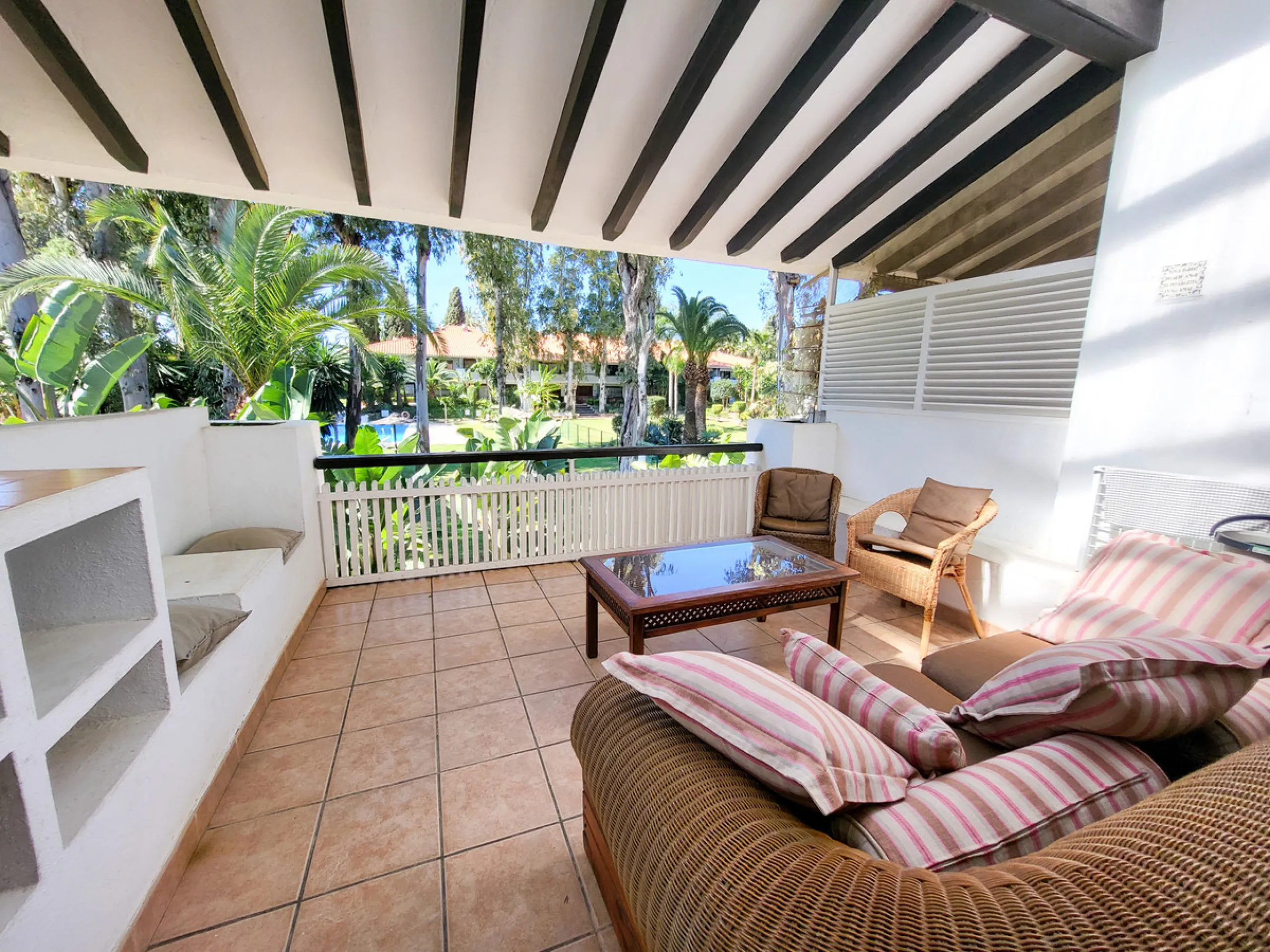This is an excellent opportunity to own a beautifully renovated two-bedroom, two-bathroom apartment in a sought-after, gated community by the beach.