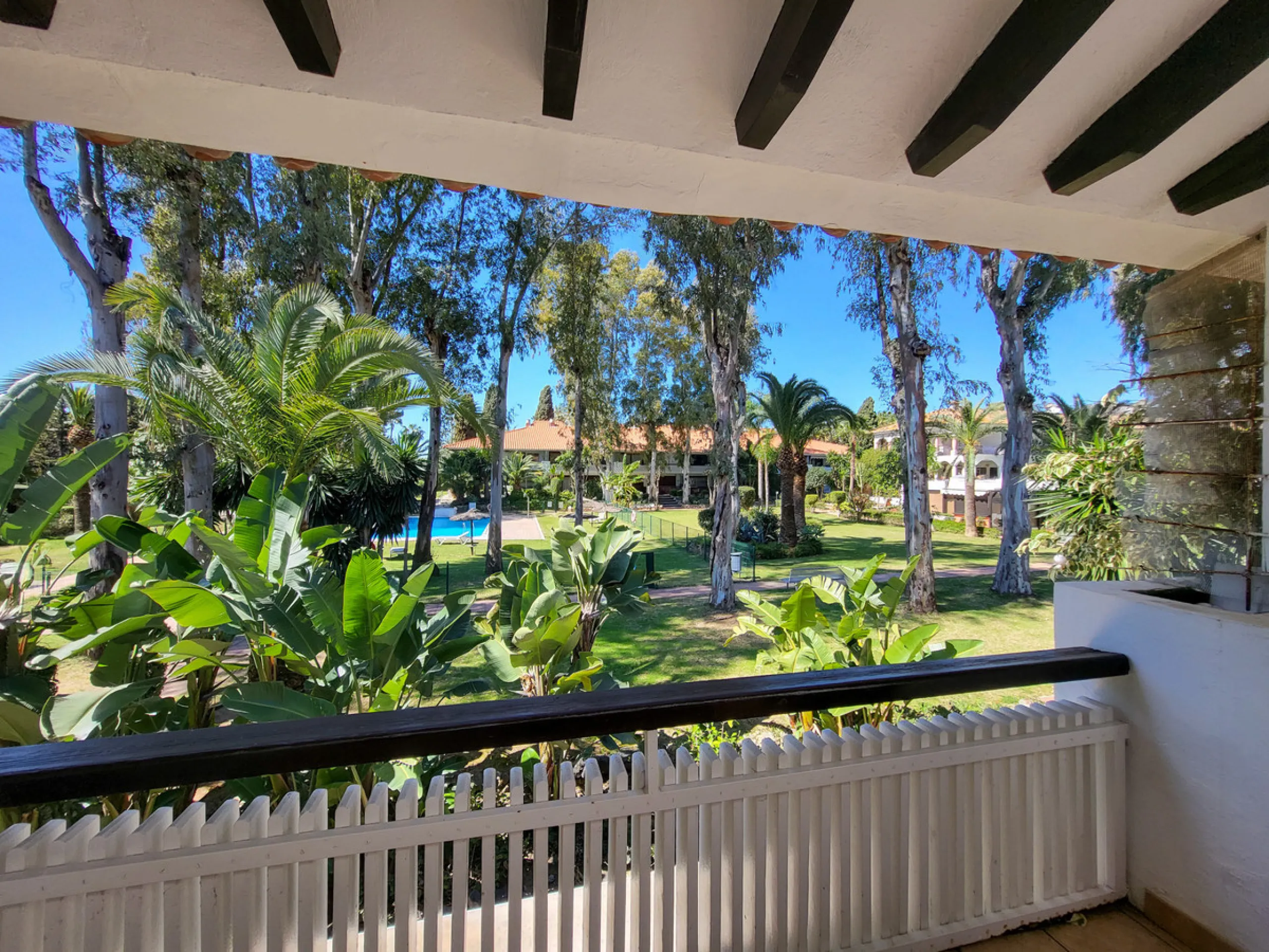 This is an excellent opportunity to own a beautifully renovated two-bedroom, two-bathroom apartment in a sought-after, gated community by the beach.