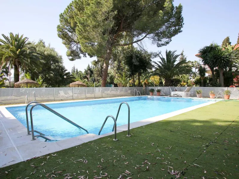 This is an excellent opportunity to own a beautifully renovated two-bedroom, two-bathroom apartment in a sought-after, gated community by the beach.