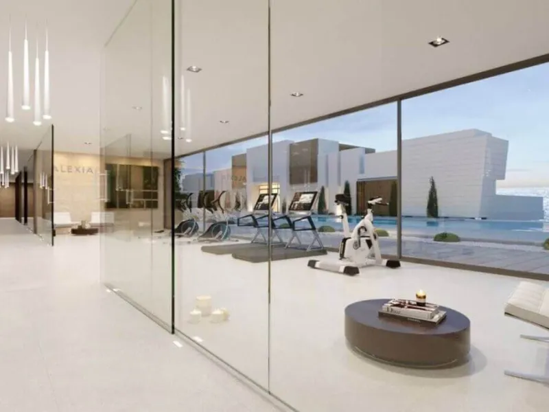 Modern three-bedroom apartment with exceptional terrace, gym, and pool area.