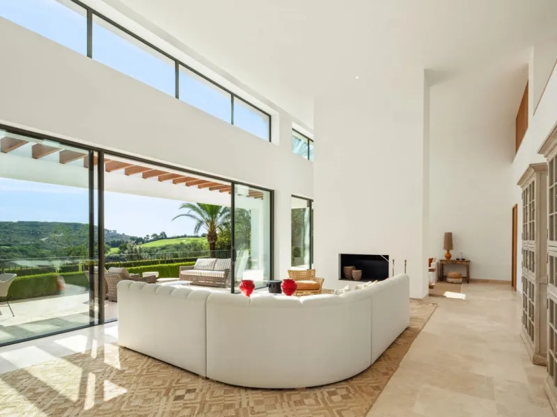 Situated in the exclusive Green 10 enclave within the prestigious Finca Cortesin Resort, this elegant villa offers a modern interpretation of luxury golfside living. Set across two levels, the home features a spacious open-plan living area with soaring ce