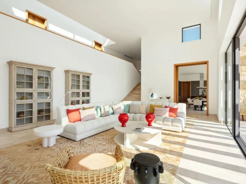 Situated in the exclusive Green 10 enclave within the prestigious Finca Cortesin Resort, this elegant villa offers a modern interpretation of luxury golfside living. Set across two levels, the home features a spacious open-plan living area with soaring ce