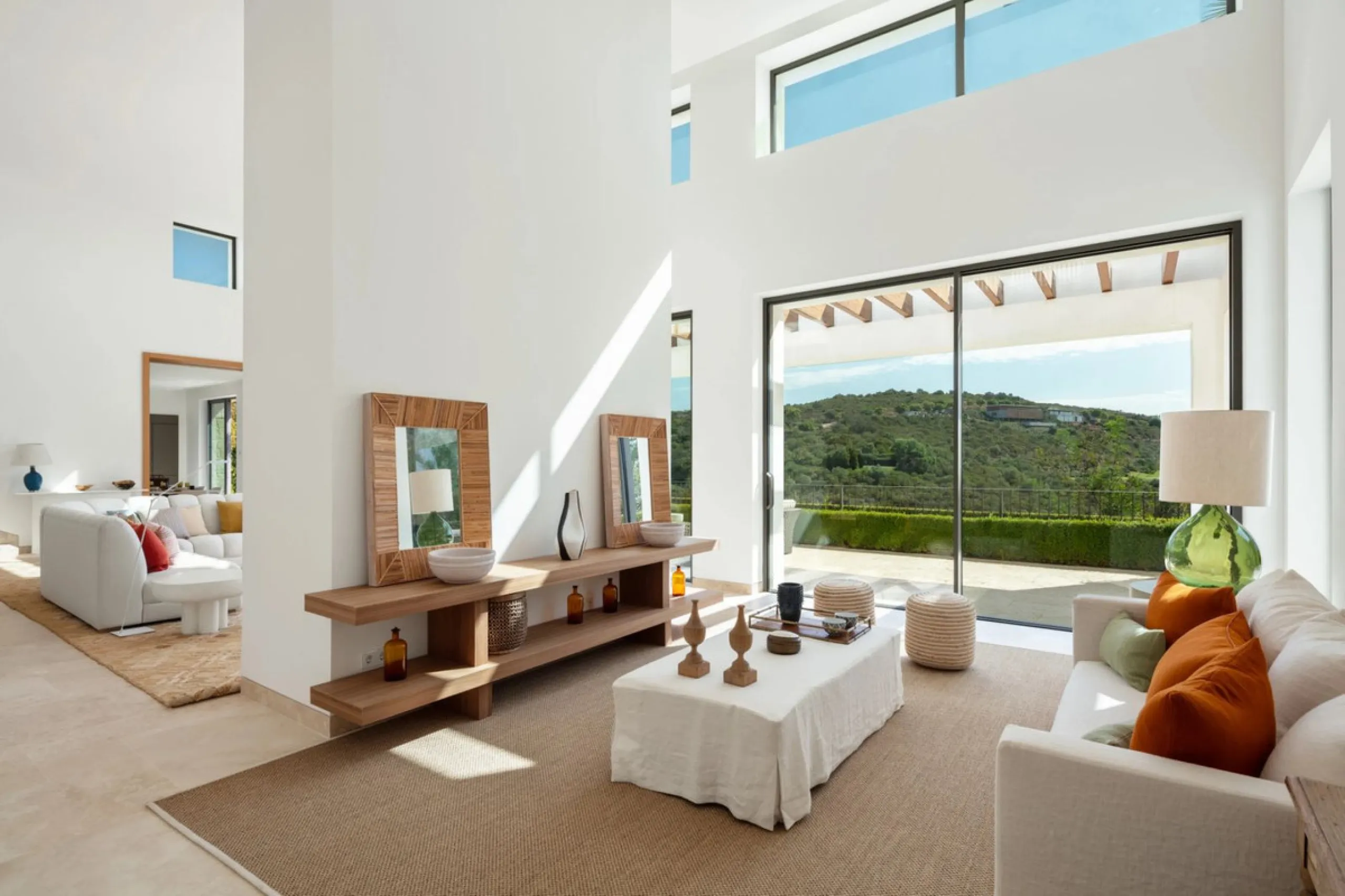 Situated in the exclusive Green 10 enclave within the prestigious Finca Cortesin Resort, this elegant villa offers a modern interpretation of luxury golfside living. Set across two levels, the home features a spacious open-plan living area with soaring ce