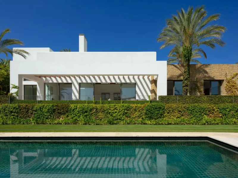 Situated in the exclusive Green 10 enclave within the prestigious Finca Cortesin Resort, this elegant villa offers a modern interpretation of luxury golfside living. Set across two levels, the home features a spacious open-plan living area with soaring ce