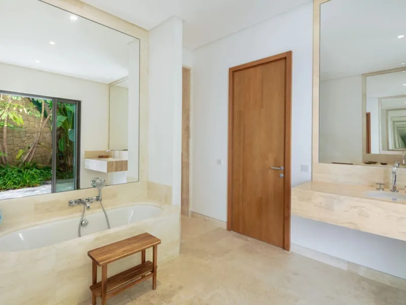 Situated in the exclusive Green 10 enclave within the prestigious Finca Cortesin Resort, this elegant villa offers a modern interpretation of luxury golfside living. Set across two levels, the home features a spacious open-plan living area with soaring ce