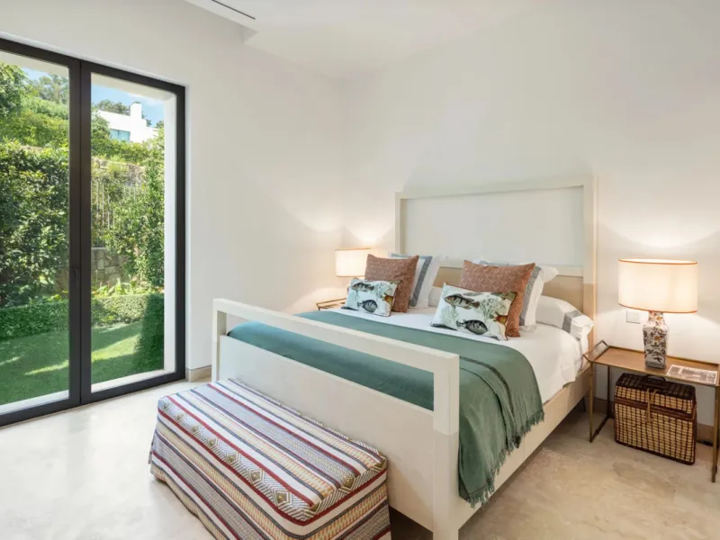 Situated in the exclusive Green 10 enclave within the prestigious Finca Cortesin Resort, this elegant villa offers a modern interpretation of luxury golfside living. Set across two levels, the home features a spacious open-plan living area with soaring ce