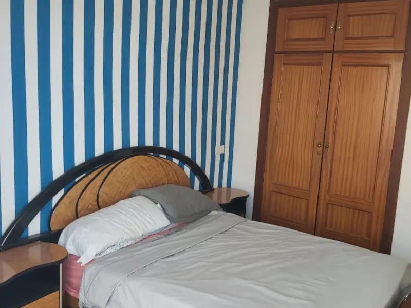 For sale: a bright top-floor apartment located in a quiet, well-connected building. The property features 2 bedrooms, 1 full bathroom, a spacious living room, and an independent kitchen.
