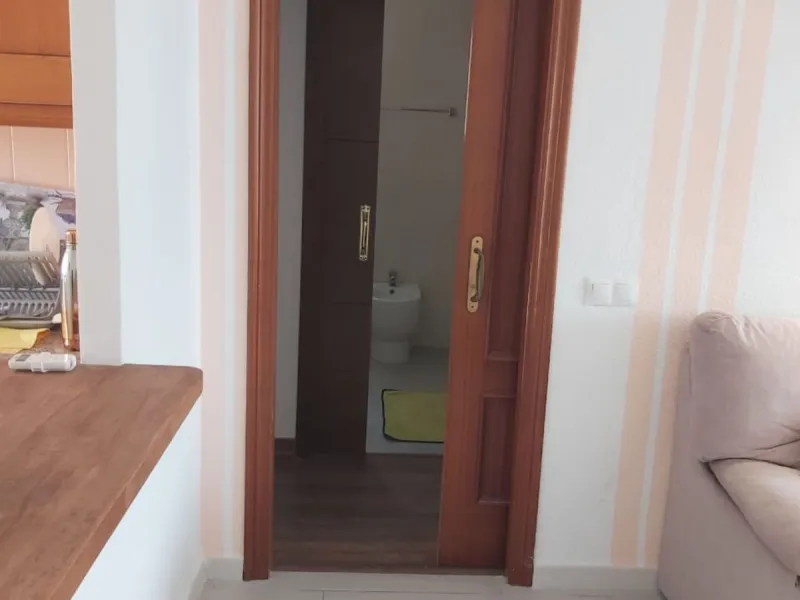 For sale: a bright top-floor apartment located in a quiet, well-connected building. The property features 2 bedrooms, 1 full bathroom, a spacious living room, and an independent kitchen.