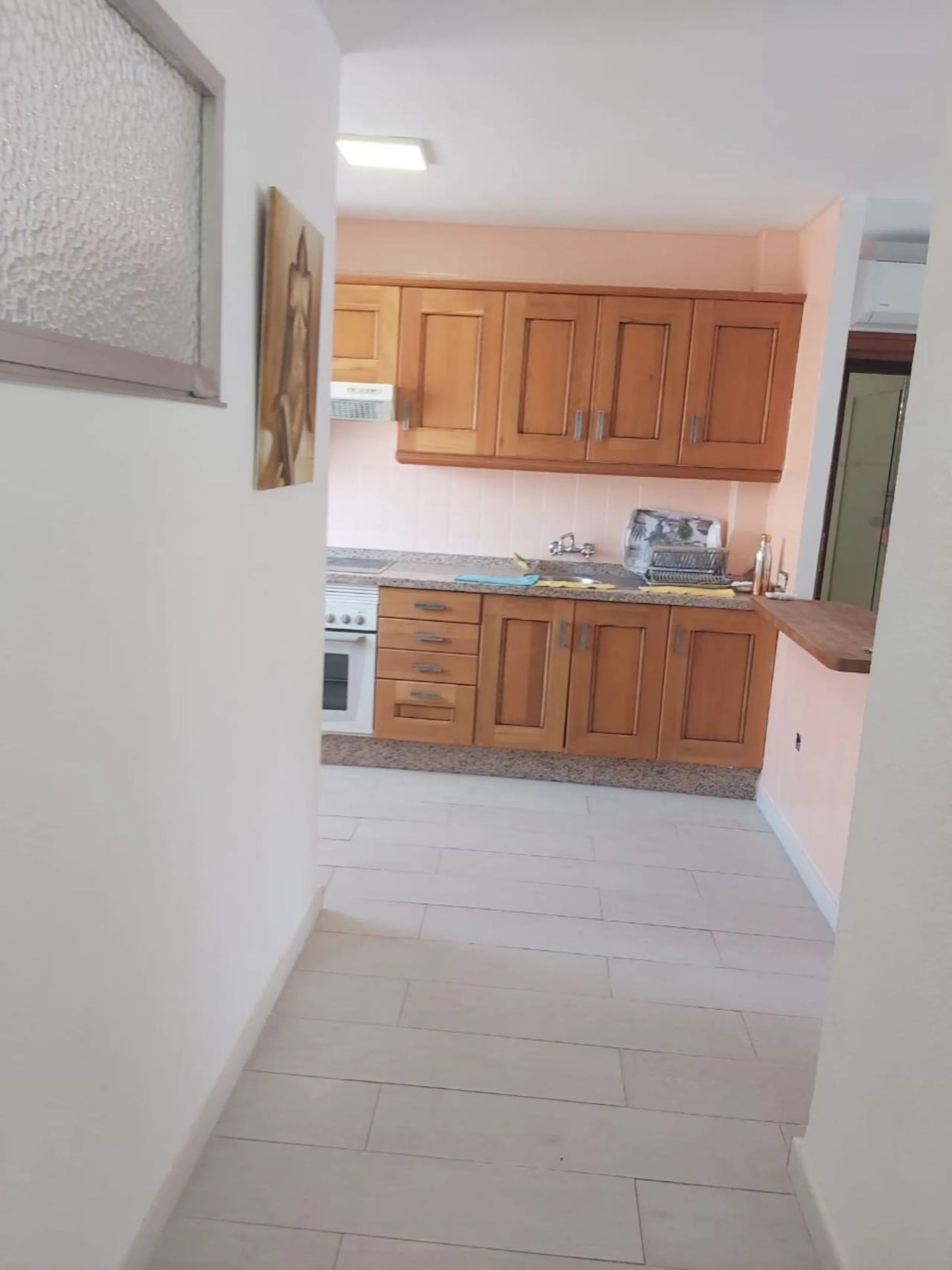 For sale: a bright top-floor apartment located in a quiet, well-connected building. The property features 2 bedrooms, 1 full bathroom, a spacious living room, and an independent kitchen.