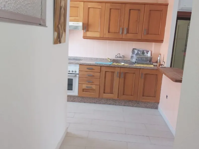 For sale: a bright top-floor apartment located in a quiet, well-connected building. The property features 2 bedrooms, 1 full bathroom, a spacious living room, and an independent kitchen.