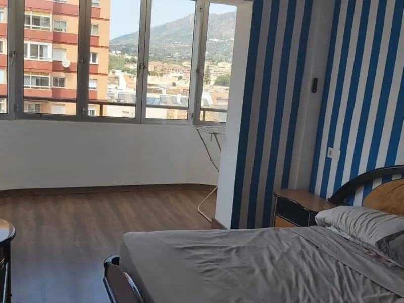 For sale: a bright top-floor apartment located in a quiet, well-connected building. The property features 2 bedrooms, 1 full bathroom, a spacious living room, and an independent kitchen.