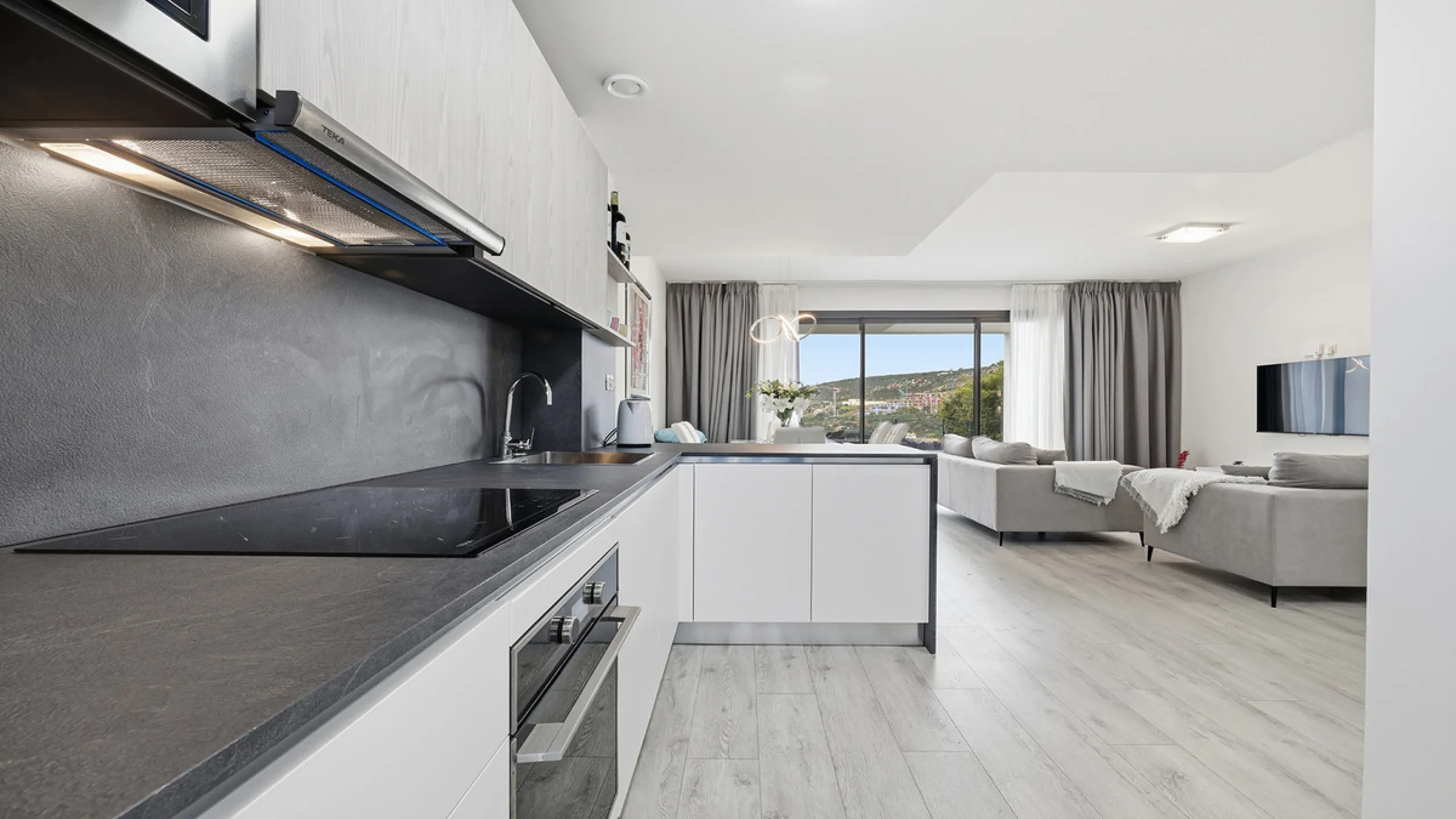 This stylish three bedroom townhouse is set within the popular Golden View I development, an elevated residential community known for its open sea views that stretch all the way to Gibraltar and the coast of Morocco. Thanks to its southwest facing orienta