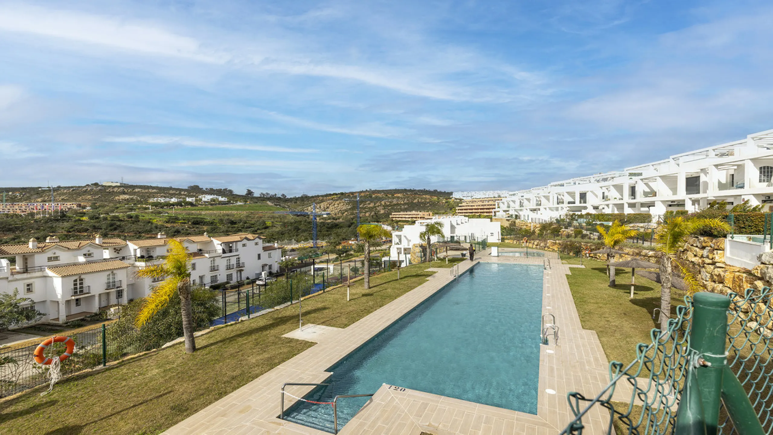 This stylish three bedroom townhouse is set within the popular Golden View I development, an elevated residential community known for its open sea views that stretch all the way to Gibraltar and the coast of Morocco. Thanks to its southwest facing orienta