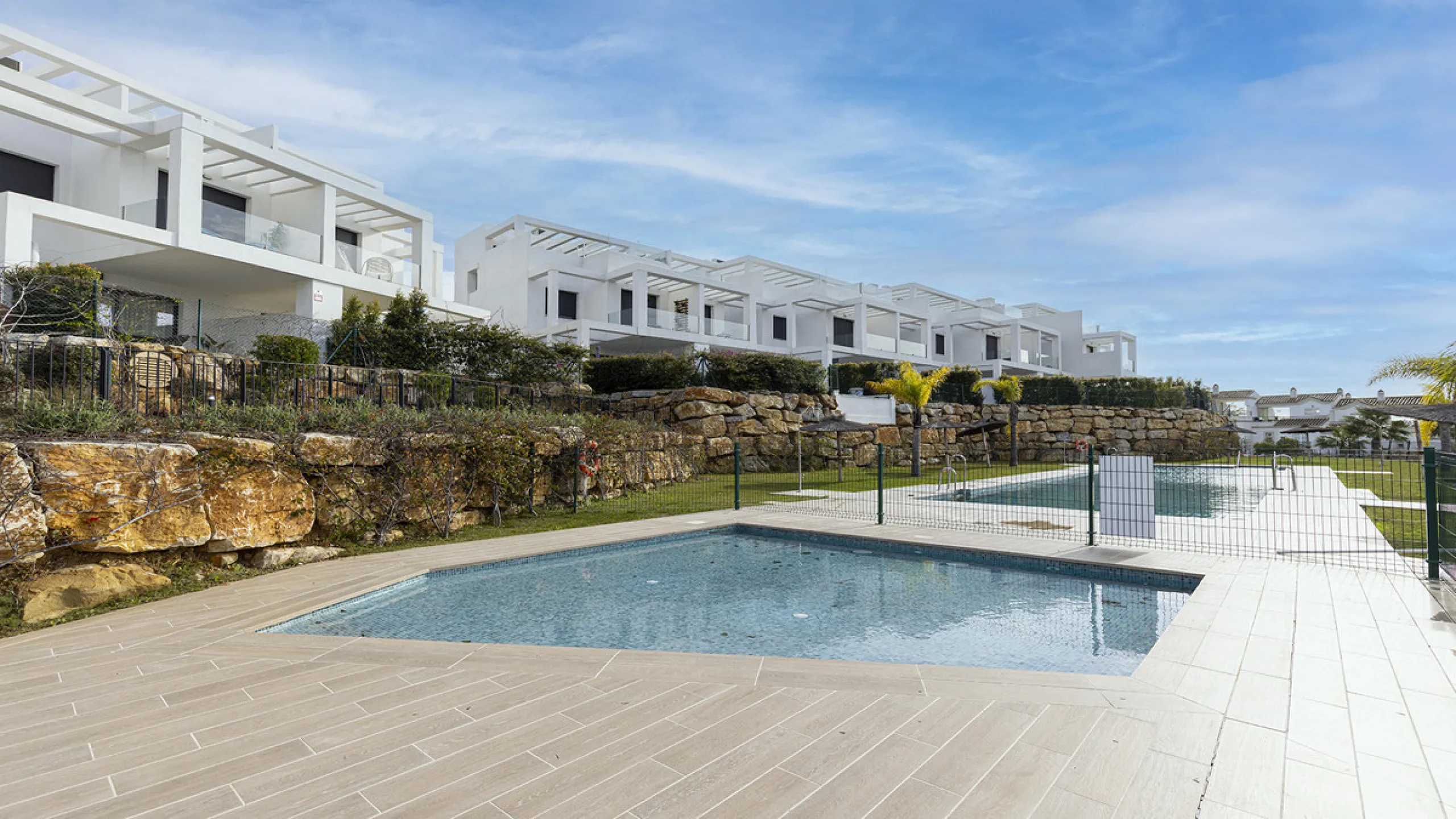 This stylish three bedroom townhouse is set within the popular Golden View I development, an elevated residential community known for its open sea views that stretch all the way to Gibraltar and the coast of Morocco. Thanks to its southwest facing orienta