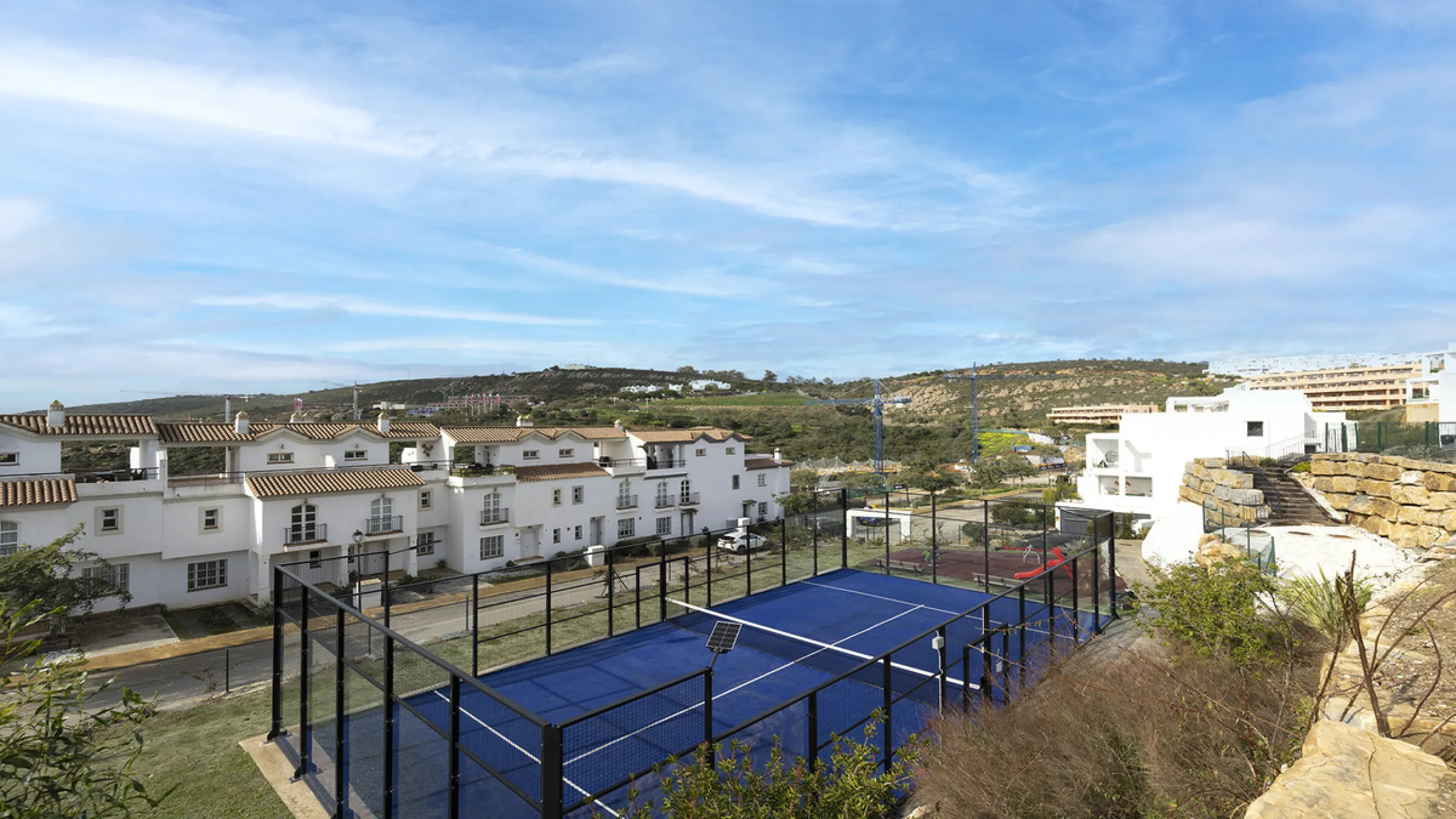 This stylish three bedroom townhouse is set within the popular Golden View I development, an elevated residential community known for its open sea views that stretch all the way to Gibraltar and the coast of Morocco. Thanks to its southwest facing orienta
