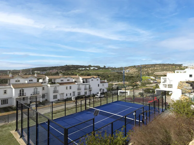 This stylish three bedroom townhouse is set within the popular Golden View I development, an elevated residential community known for its open sea views that stretch all the way to Gibraltar and the coast of Morocco. Thanks to its southwest facing orienta