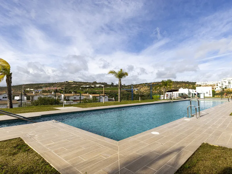 This stylish three bedroom townhouse is set within the popular Golden View I development, an elevated residential community known for its open sea views that stretch all the way to Gibraltar and the coast of Morocco. Thanks to its southwest facing orienta