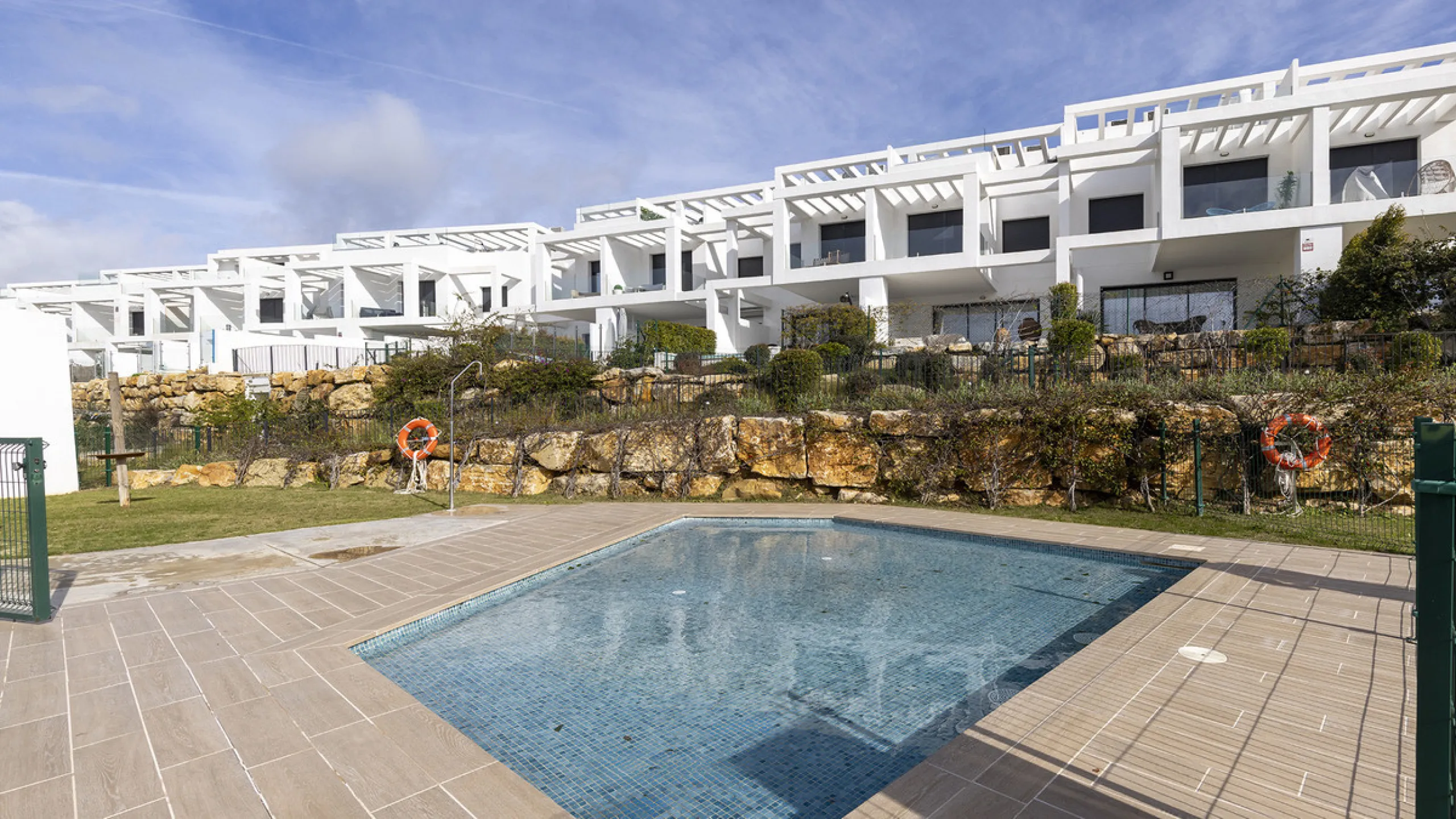 This stylish three bedroom townhouse is set within the popular Golden View I development, an elevated residential community known for its open sea views that stretch all the way to Gibraltar and the coast of Morocco. Thanks to its southwest facing orienta