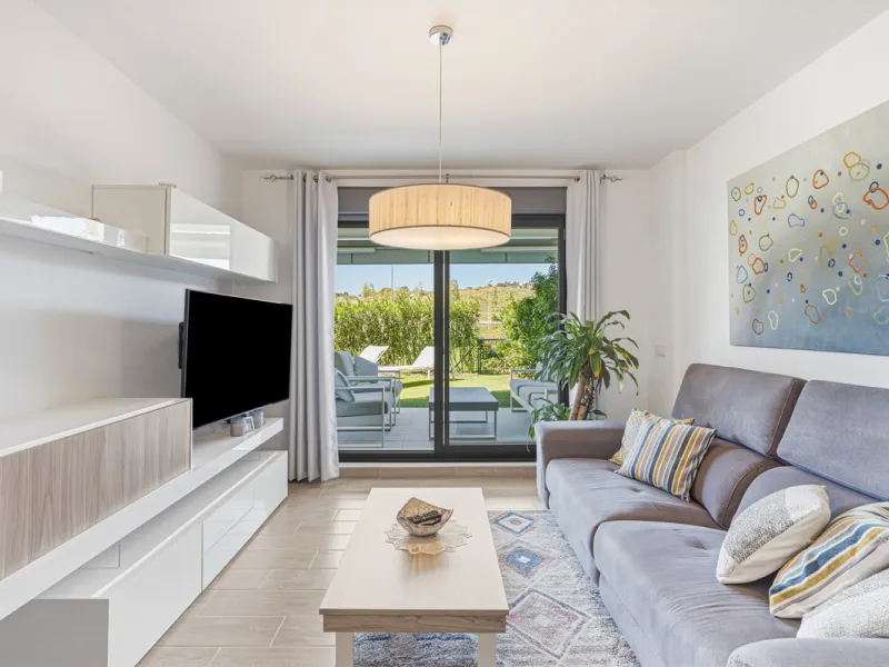 This bright and spacious two-bedroom ground floor apartment is ideally located within the sought-after gated community of El Lagar in La Cala de Mijas. Both bedrooms enjoy direct access to a generous terrace and private garden, offering plenty of natural 
