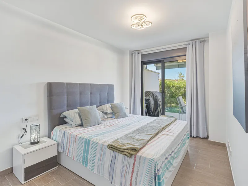 This bright and spacious two-bedroom ground floor apartment is ideally located within the sought-after gated community of El Lagar in La Cala de Mijas. Both bedrooms enjoy direct access to a generous terrace and private garden, offering plenty of natural 