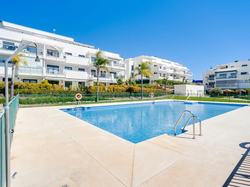 This bright and spacious two-bedroom ground floor apartment is ideally located within the sought-after gated community of El Lagar in La Cala de Mijas. Both bedrooms enjoy direct access to a generous terrace and private garden, offering plenty of natural 