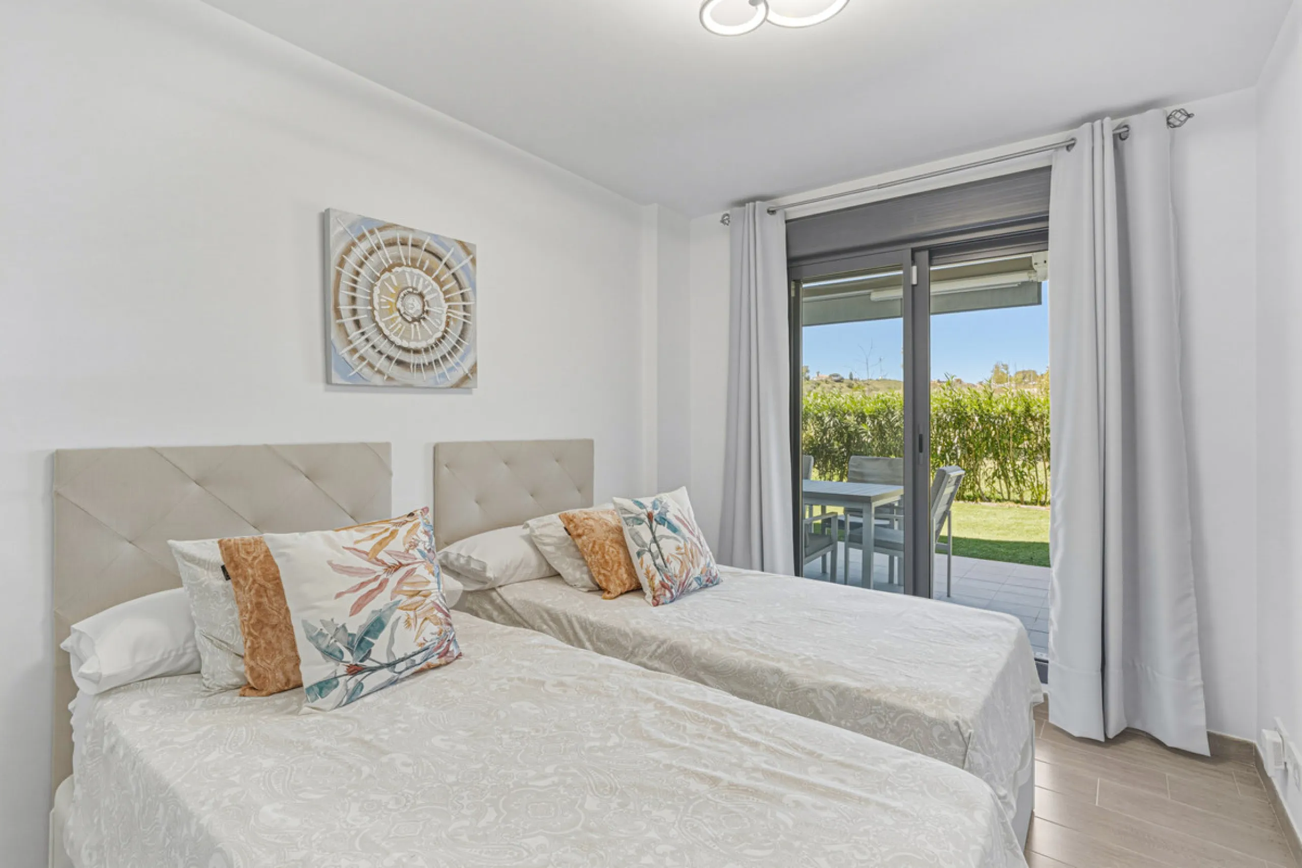 This bright and spacious two-bedroom ground floor apartment is ideally located within the sought-after gated community of El Lagar in La Cala de Mijas. Both bedrooms enjoy direct access to a generous terrace and private garden, offering plenty of natural 