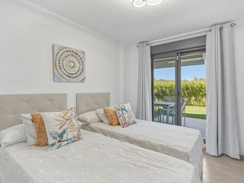 This bright and spacious two-bedroom ground floor apartment is ideally located within the sought-after gated community of El Lagar in La Cala de Mijas. Both bedrooms enjoy direct access to a generous terrace and private garden, offering plenty of natural 