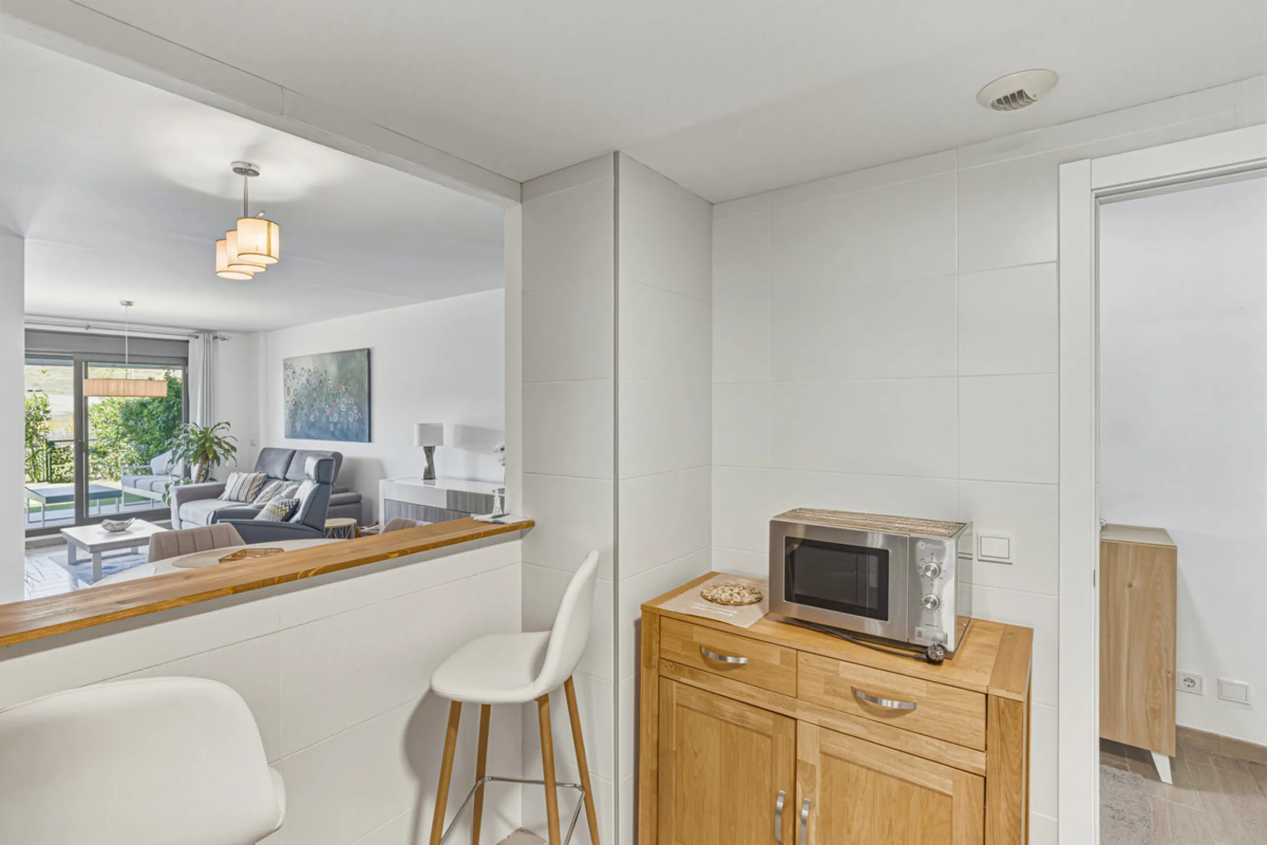 This bright and spacious two-bedroom ground floor apartment is ideally located within the sought-after gated community of El Lagar in La Cala de Mijas. Both bedrooms enjoy direct access to a generous terrace and private garden, offering plenty of natural 