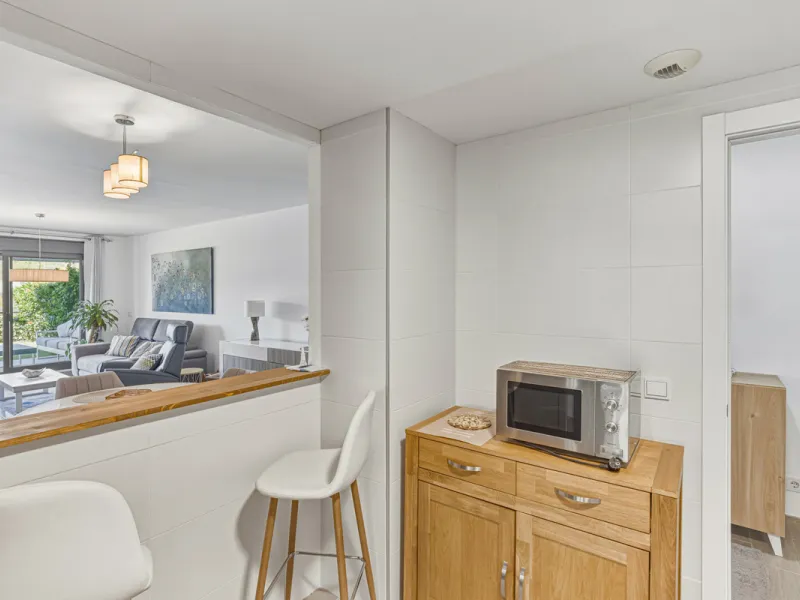 This bright and spacious two-bedroom ground floor apartment is ideally located within the sought-after gated community of El Lagar in La Cala de Mijas. Both bedrooms enjoy direct access to a generous terrace and private garden, offering plenty of natural 