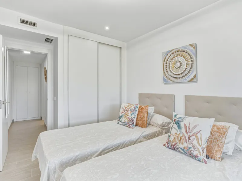 This bright and spacious two-bedroom ground floor apartment is ideally located within the sought-after gated community of El Lagar in La Cala de Mijas. Both bedrooms enjoy direct access to a generous terrace and private garden, offering plenty of natural 