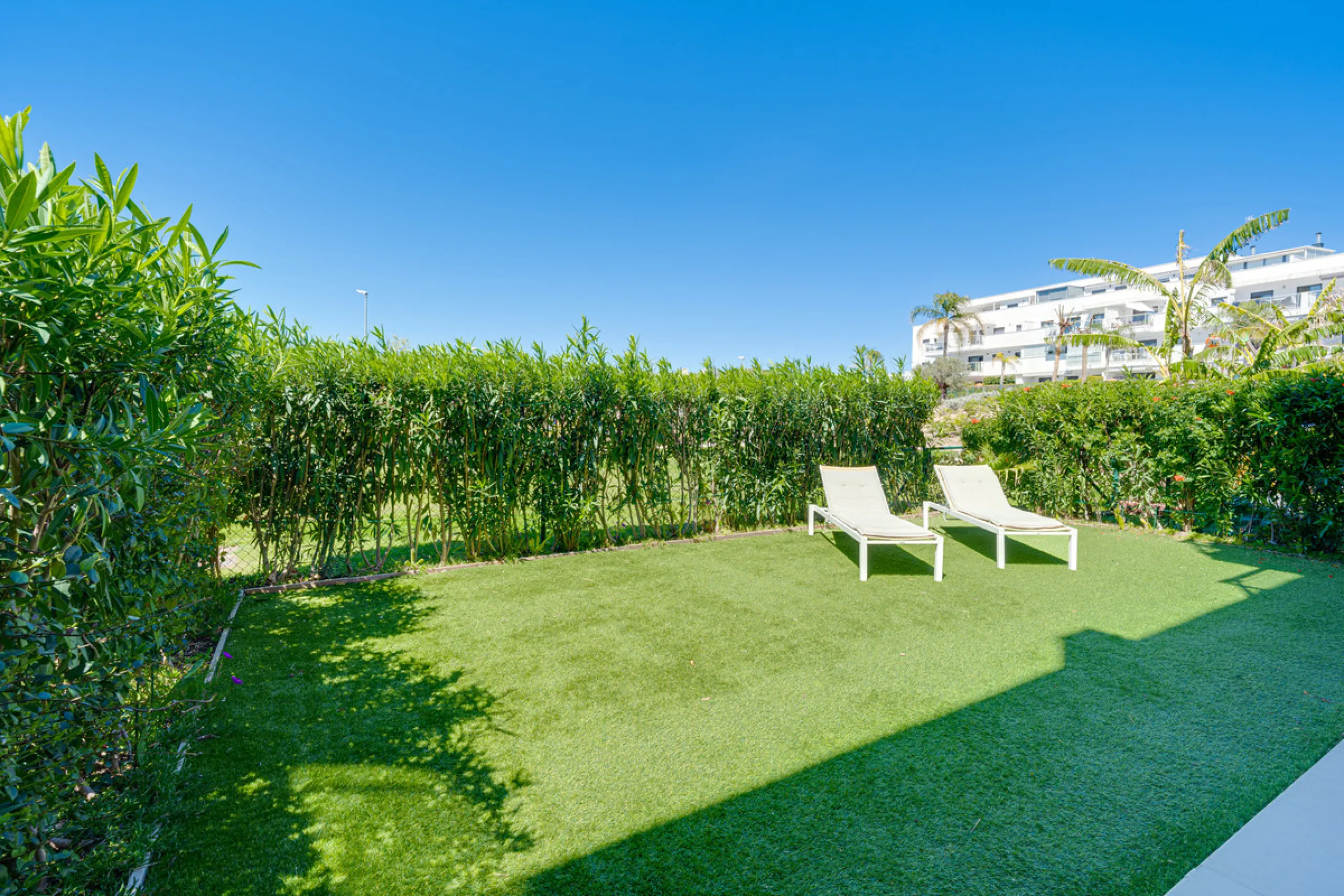 This bright and spacious two-bedroom ground floor apartment is ideally located within the sought-after gated community of El Lagar in La Cala de Mijas. Both bedrooms enjoy direct access to a generous terrace and private garden, offering plenty of natural 