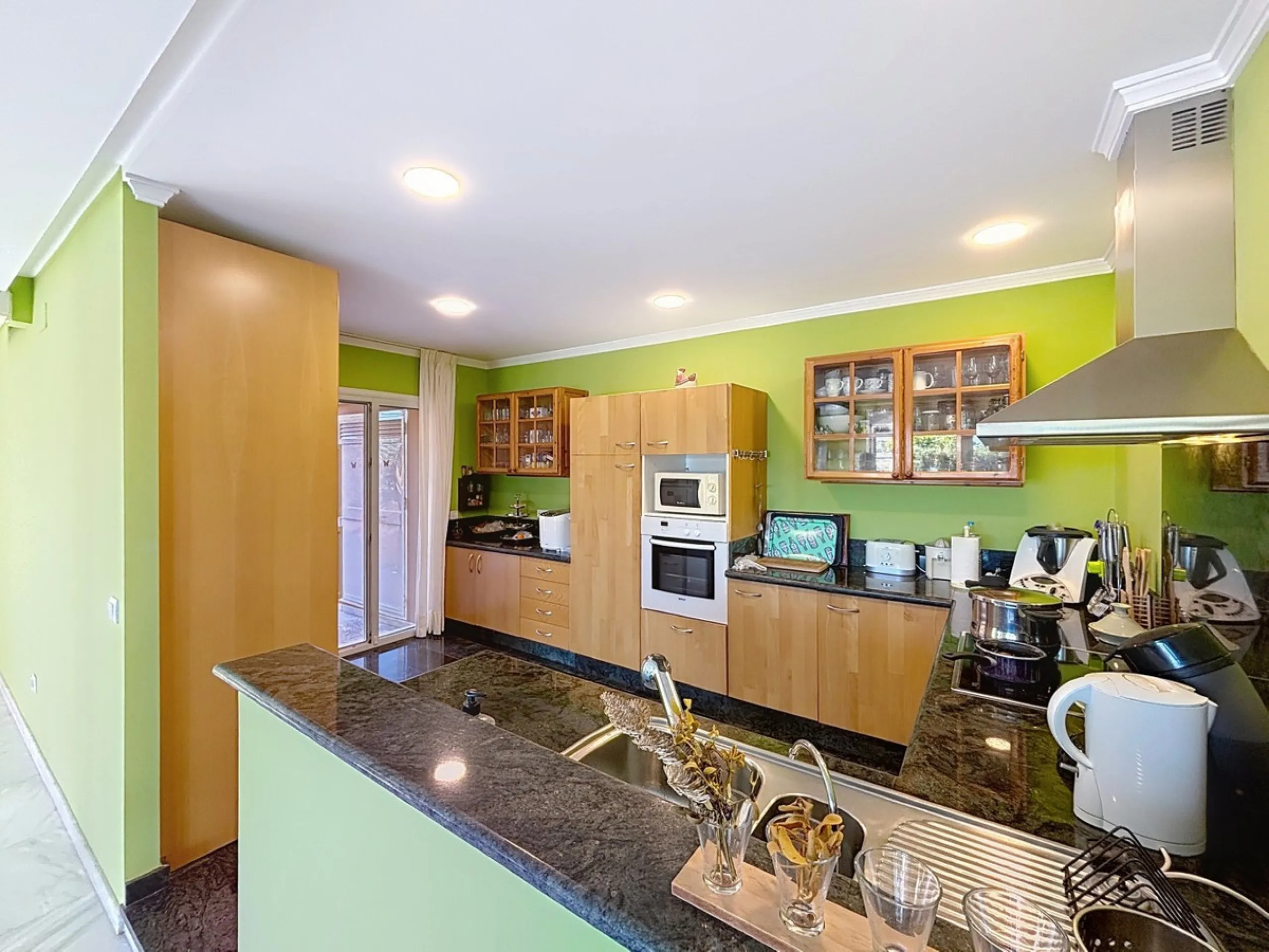 Discover your corner of paradise in this captivating three-bedroom, three-bathroom home, located in the sought-after El Capitan Urbanization. Distributed over two floors, this property perfectly combines modern comfort with the relaxed elegance of the Spa