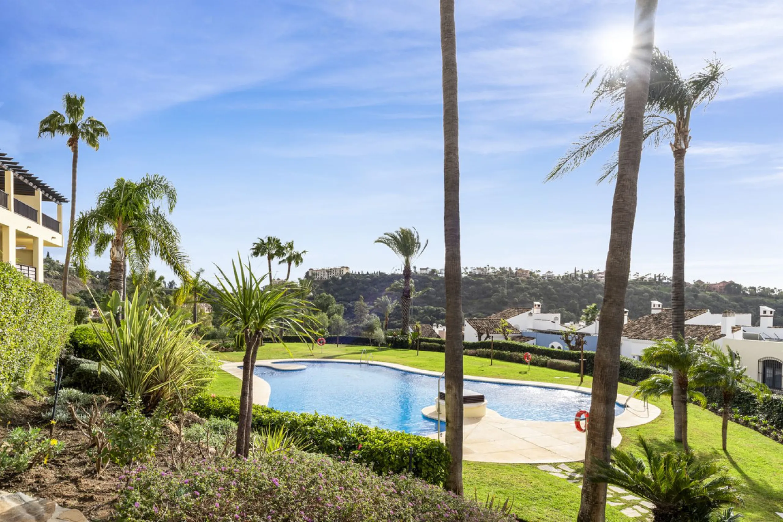 Discover this bright and elegant two bedroom first floor apartment located within the sought after Los Pinos in Los Arqueros Golf and Country Club. Set in a peaceful and secure environment, the property enjoys an elevated position with beautiful open view