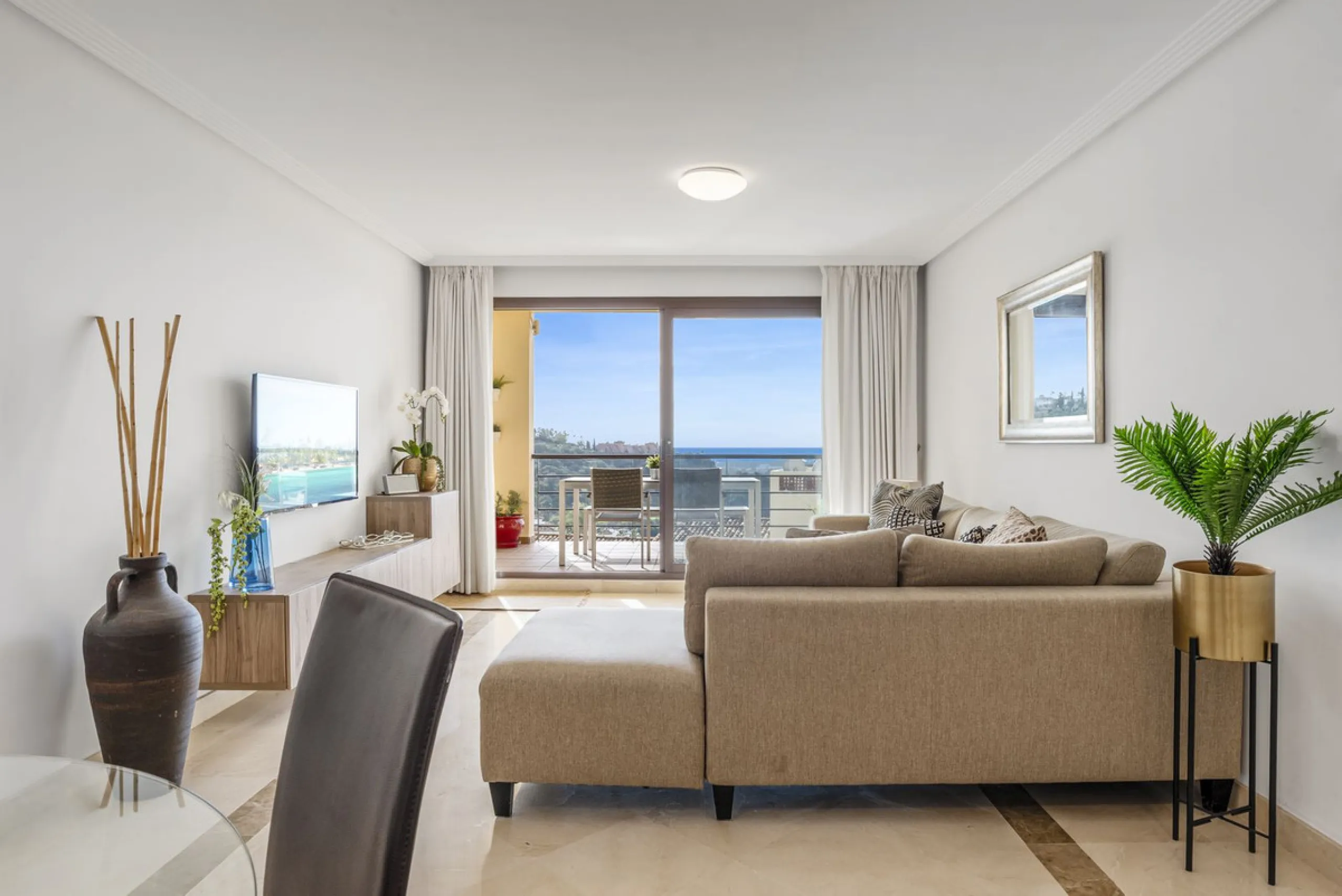 Discover this bright and elegant two bedroom first floor apartment located within the sought after Los Pinos in Los Arqueros Golf and Country Club. Set in a peaceful and secure environment, the property enjoys an elevated position with beautiful open view