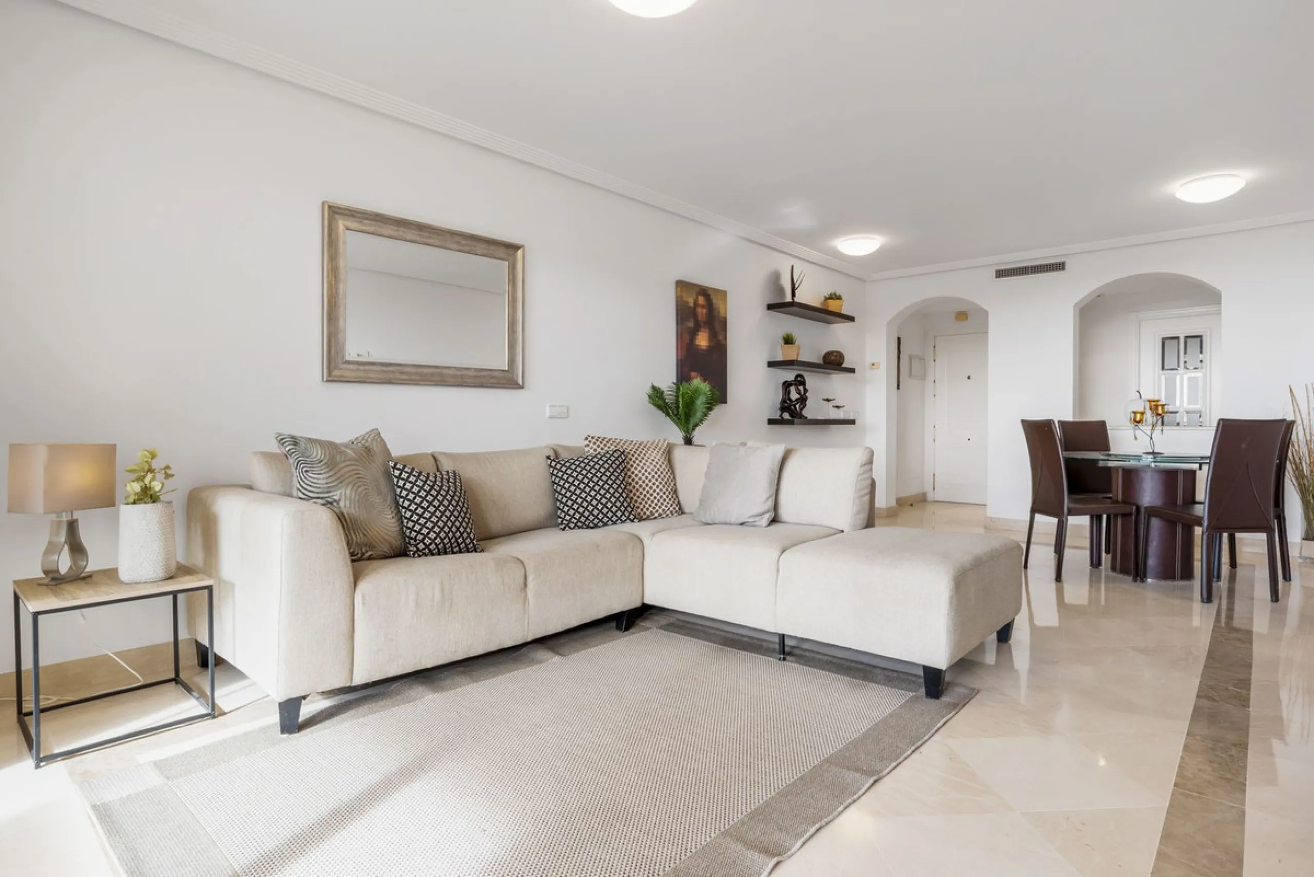 Discover this bright and elegant two bedroom first floor apartment located within the sought after Los Pinos in Los Arqueros Golf and Country Club. Set in a peaceful and secure environment, the property enjoys an elevated position with beautiful open view