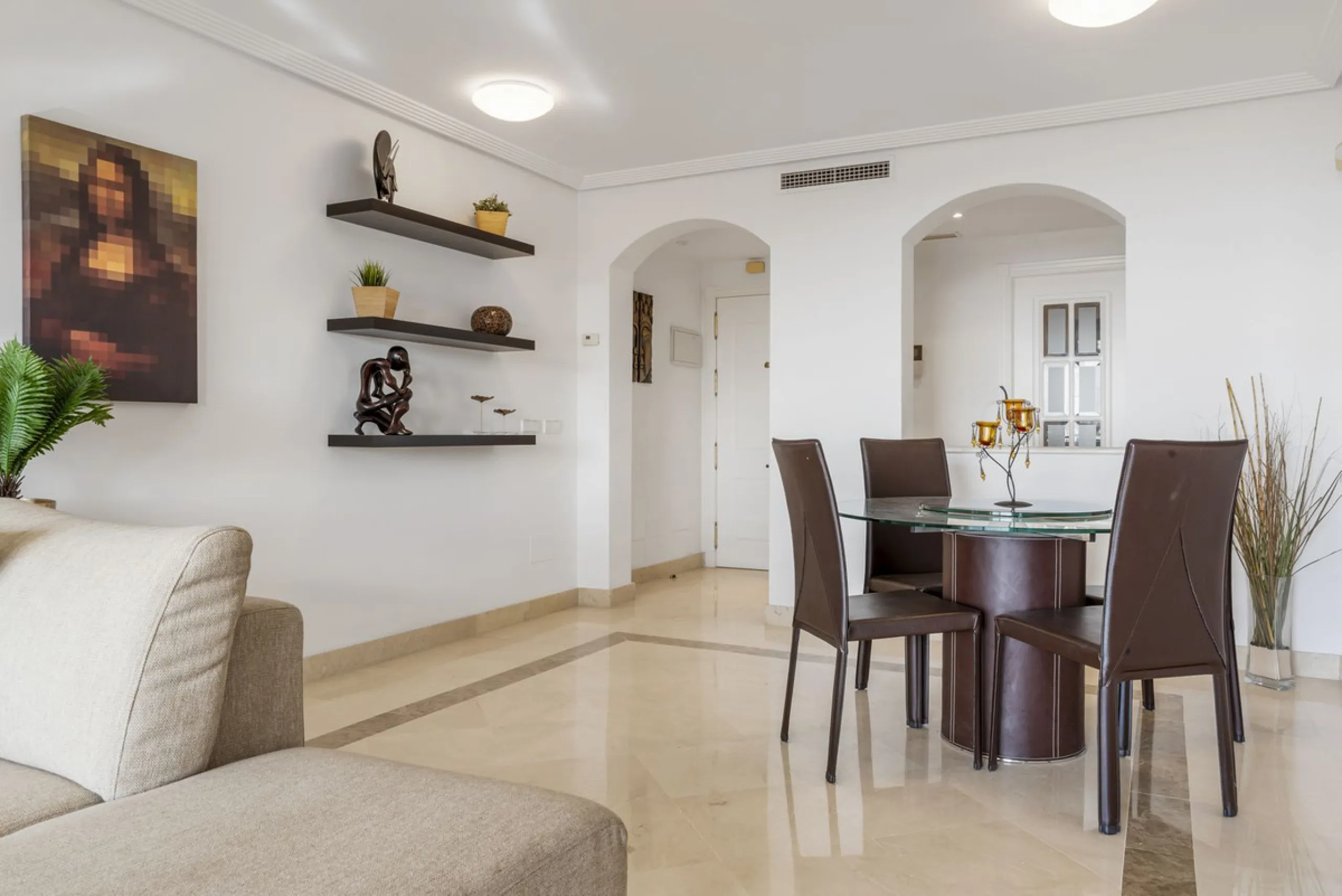Discover this bright and elegant two bedroom first floor apartment located within the sought after Los Pinos in Los Arqueros Golf and Country Club. Set in a peaceful and secure environment, the property enjoys an elevated position with beautiful open view