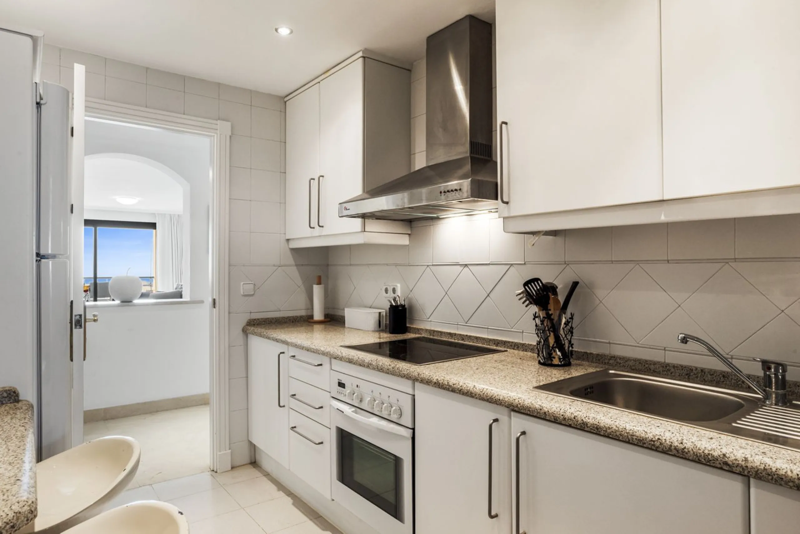 Discover this bright and elegant two bedroom first floor apartment located within the sought after Los Pinos in Los Arqueros Golf and Country Club. Set in a peaceful and secure environment, the property enjoys an elevated position with beautiful open view