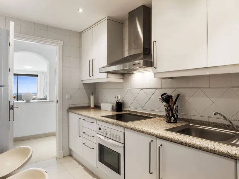 Discover this bright and elegant two bedroom first floor apartment located within the sought after Los Pinos in Los Arqueros Golf and Country Club. Set in a peaceful and secure environment, the property enjoys an elevated position with beautiful open view