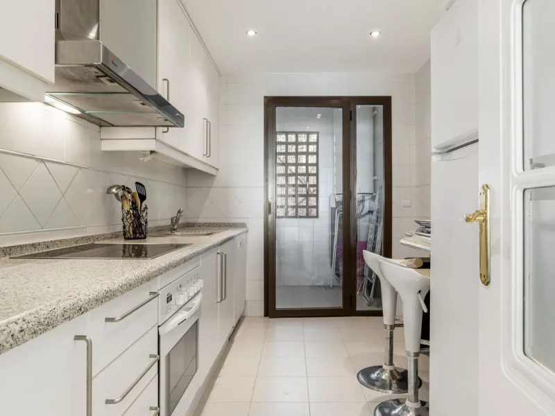 Discover this bright and elegant two bedroom first floor apartment located within the sought after Los Pinos in Los Arqueros Golf and Country Club. Set in a peaceful and secure environment, the property enjoys an elevated position with beautiful open view