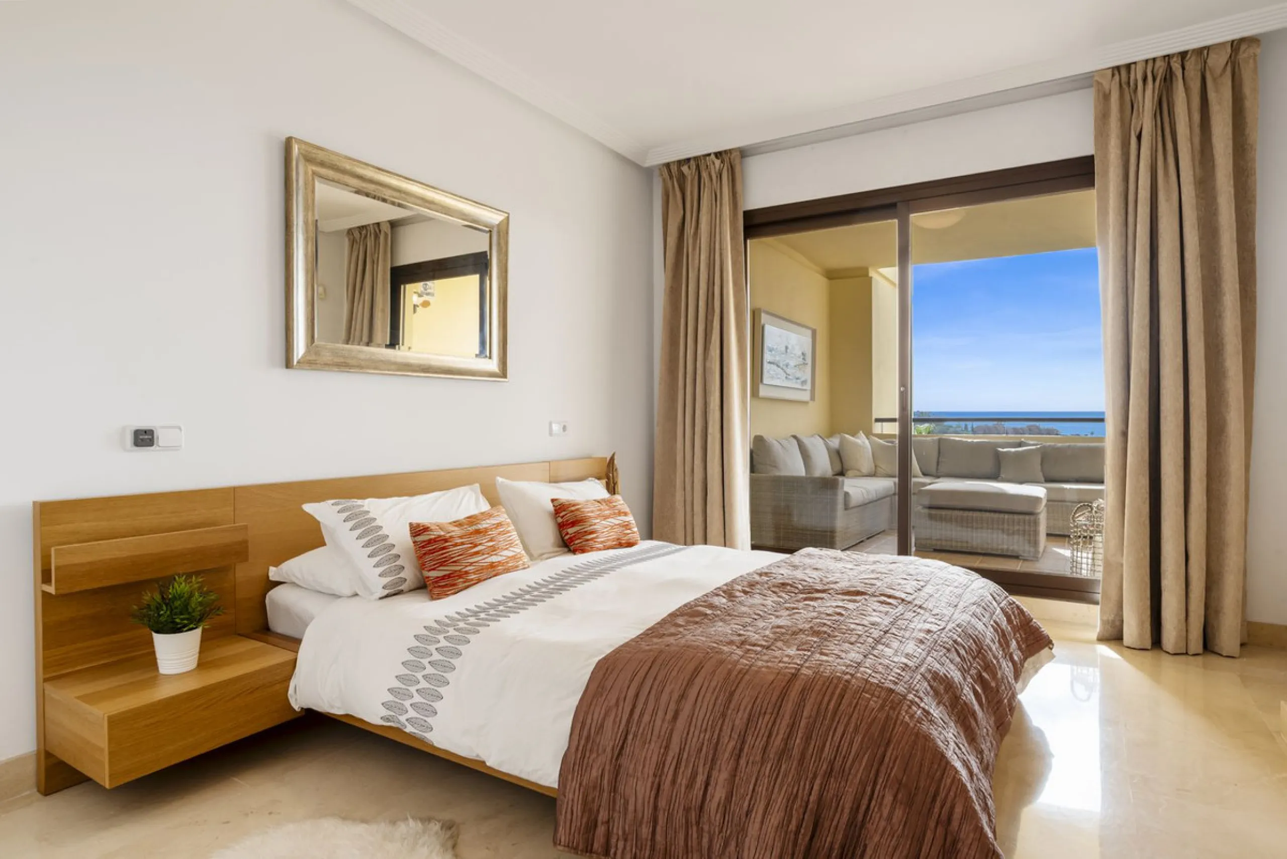 Discover this bright and elegant two bedroom first floor apartment located within the sought after Los Pinos in Los Arqueros Golf and Country Club. Set in a peaceful and secure environment, the property enjoys an elevated position with beautiful open view